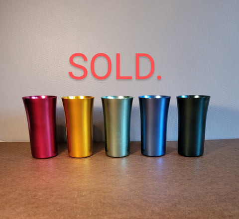 Set of 5 metal drinking vessels.