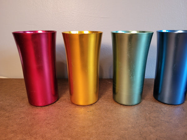 Set of 5 metal drinking vessels.