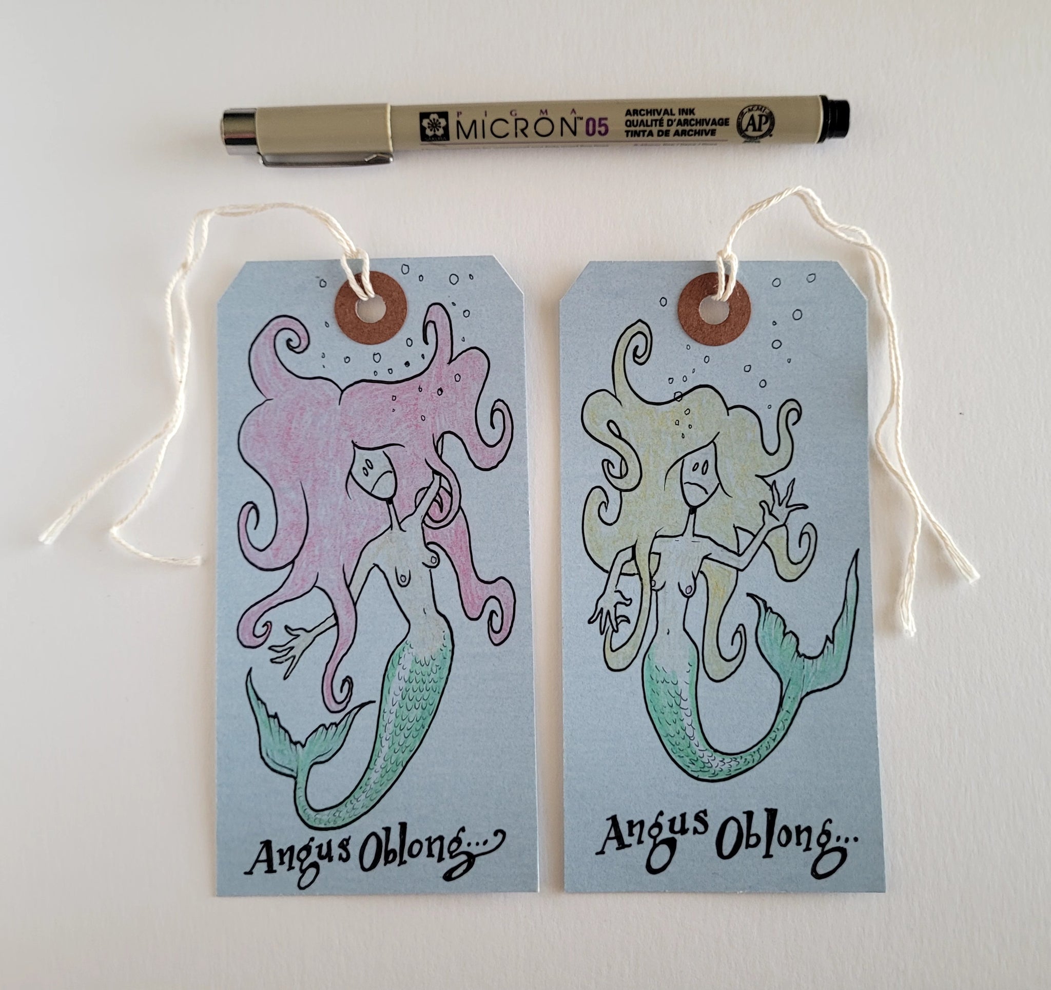 2 Dead Mermaids drawn on real Coroner's Toe Tags!