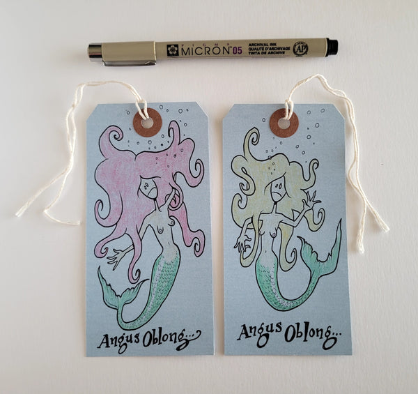 2 Dead Mermaids drawn on real Coroner's Toe Tags!