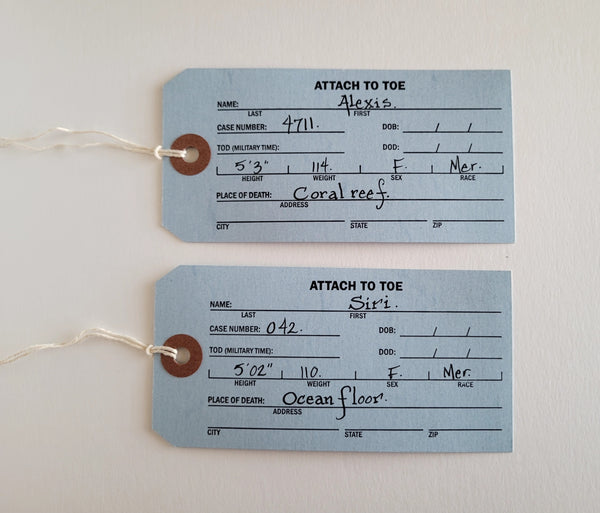 2 Dead Mermaids drawn on real Coroner's Toe Tags!